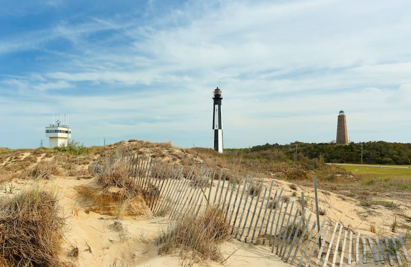 Old and new Cape Henry Lighthouses on the water in VA