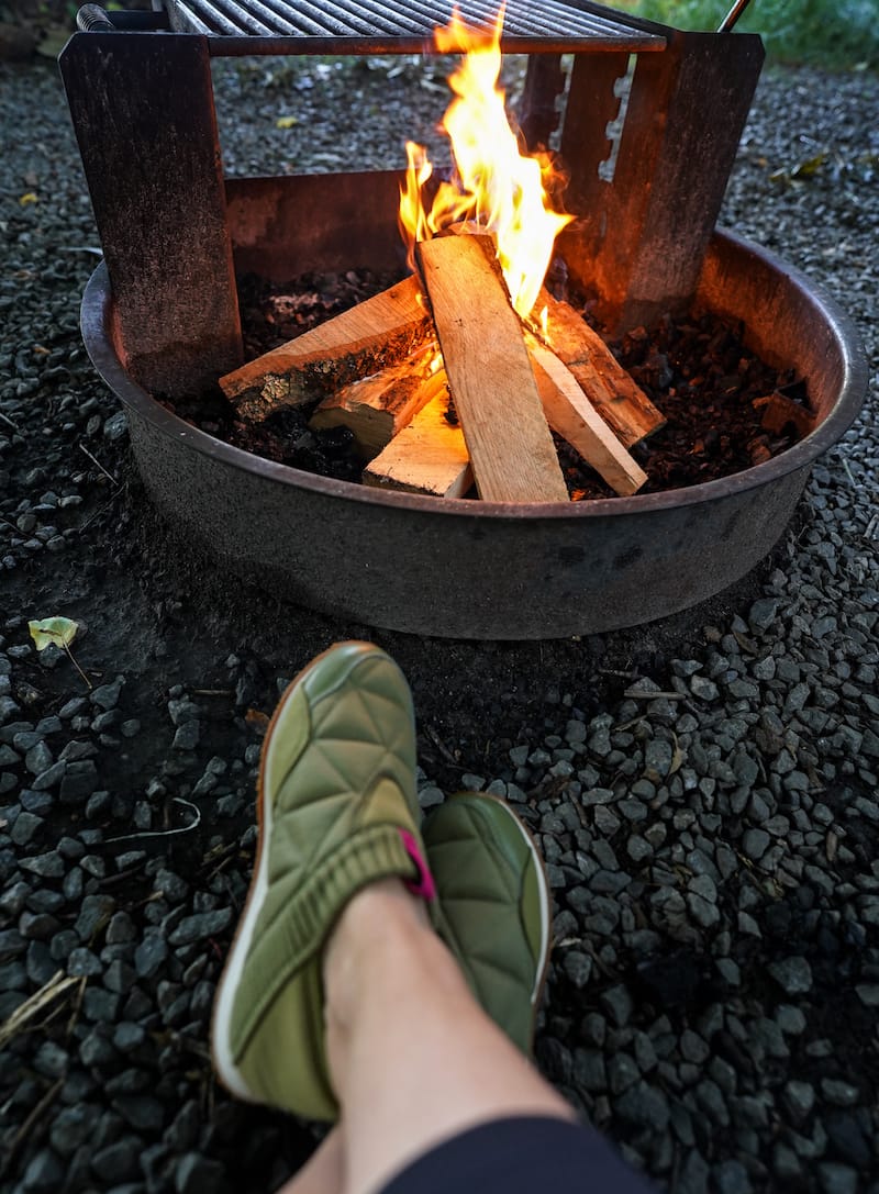Relaxing by the fire near the mountains