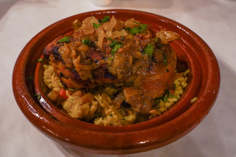 Chicken tagine with saffron rice, preserved lemons, and olives
